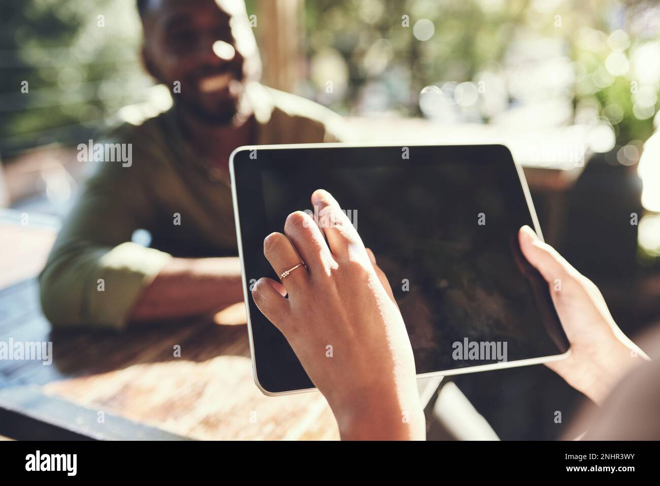 Simplifying waitering with smart technology. a young man placing his