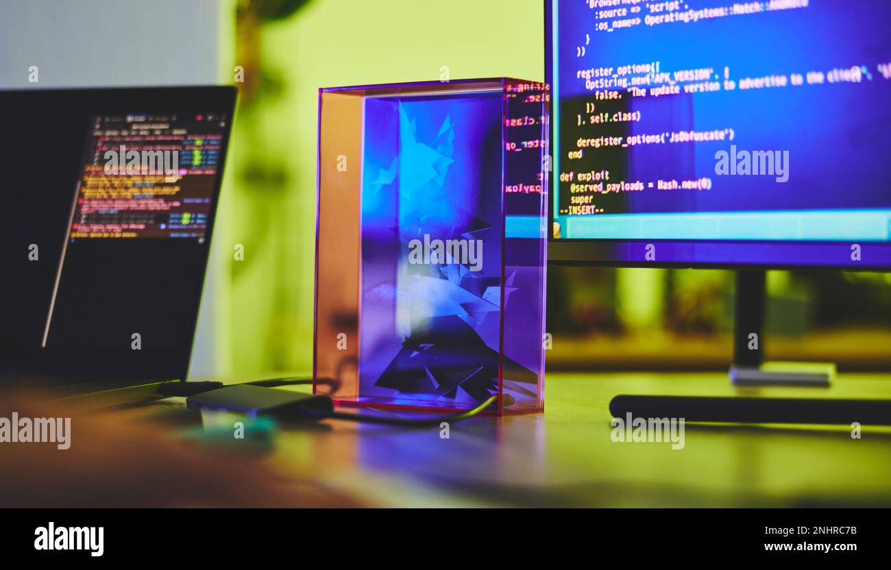 Computer screen, code and desk with programming, technology abstract ...