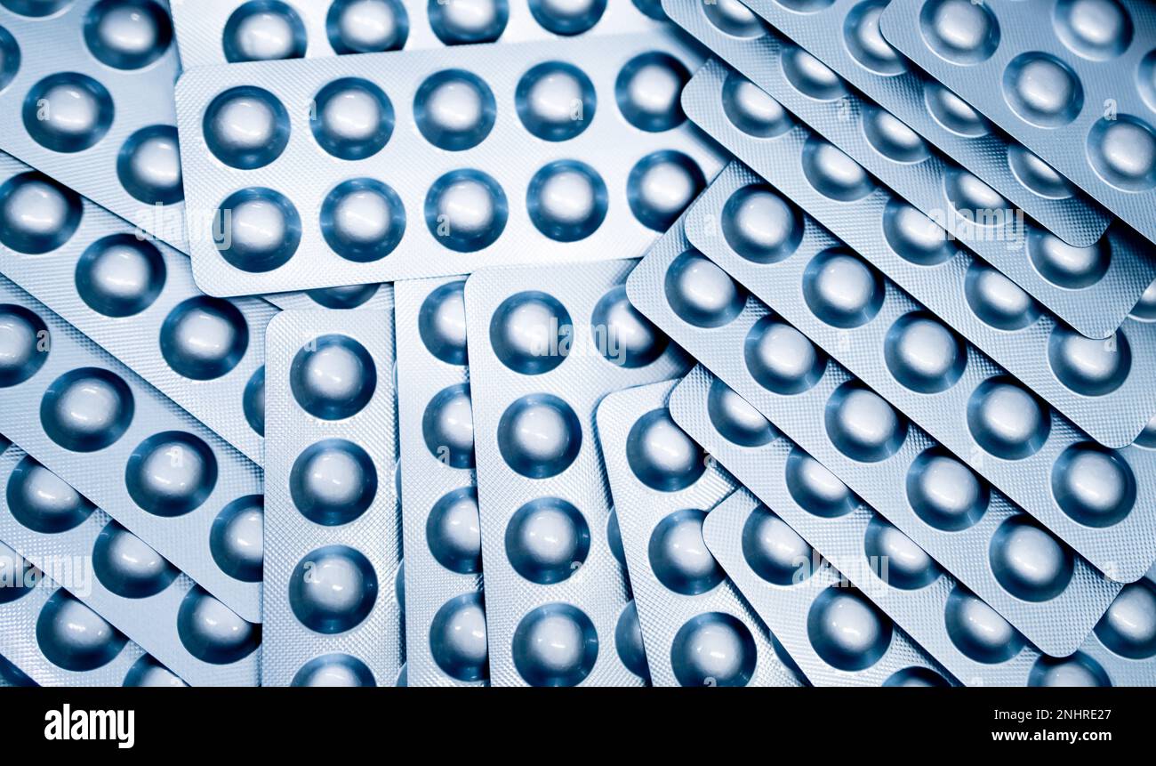 Pile of pills blister pack. Pharmaceutical industry. Prescription drugs. Pharmacy banner. Drug production. World health day background. Healthcare Stock Photo