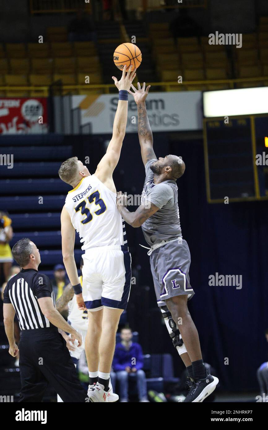 CHATTANOOGA, TN - NOVEMBER 23: Chattanooga Mocs center Jake Stephens (33)  and Lipscomb Bisons center Ahsan Asadullah (23) tip off the men's college  basketball game between the Lipscomb Bison and the UT-Chattanooga