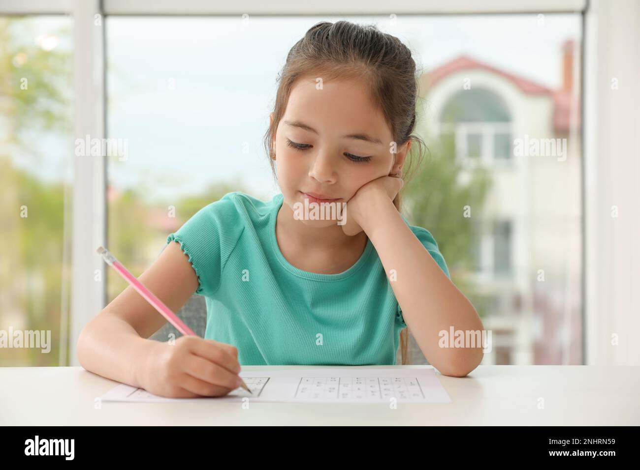 Little Girl Solving Sudoku Puzzle At Table Indoors Stock Photo Alamy Little girl solving sudoku puzzle at table indoors stock photo alamy