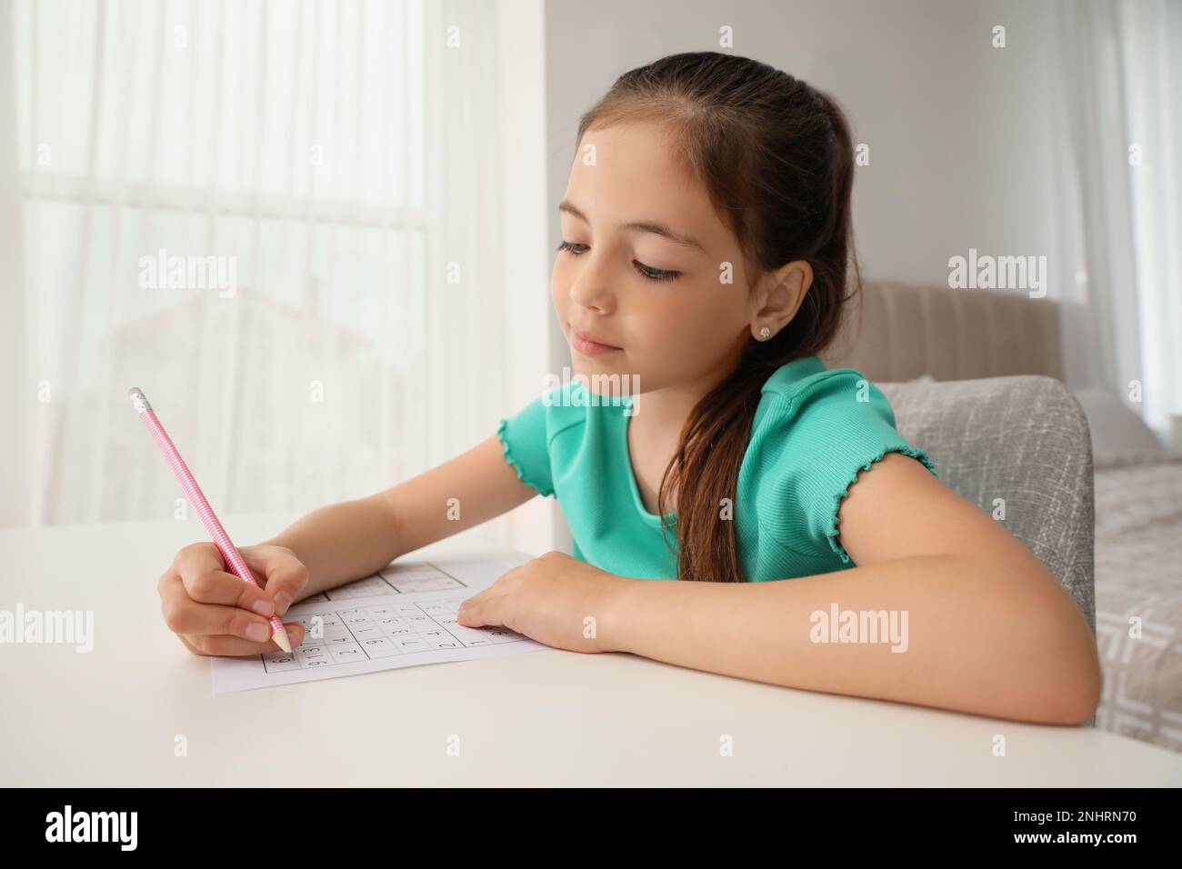Little Girl Solving Sudoku Puzzle At Table Indoors Stock Photo Alamy Little girl solving sudoku puzzle at table indoors stock photo alamy