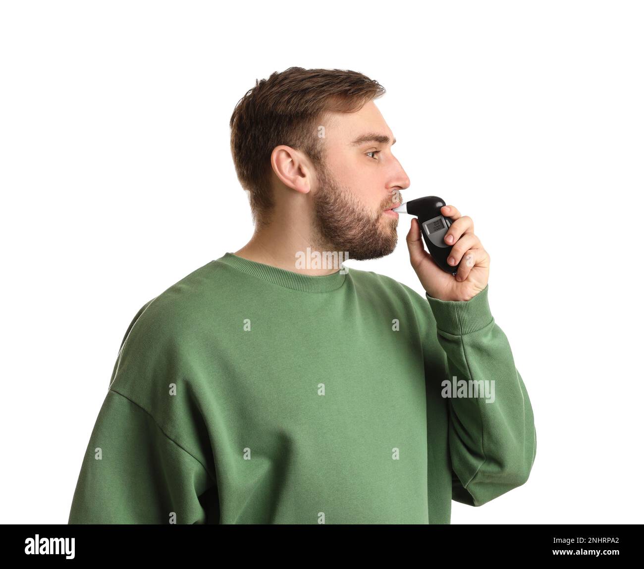 Man blowing into breathalyzer on white background Stock Photo Alamy