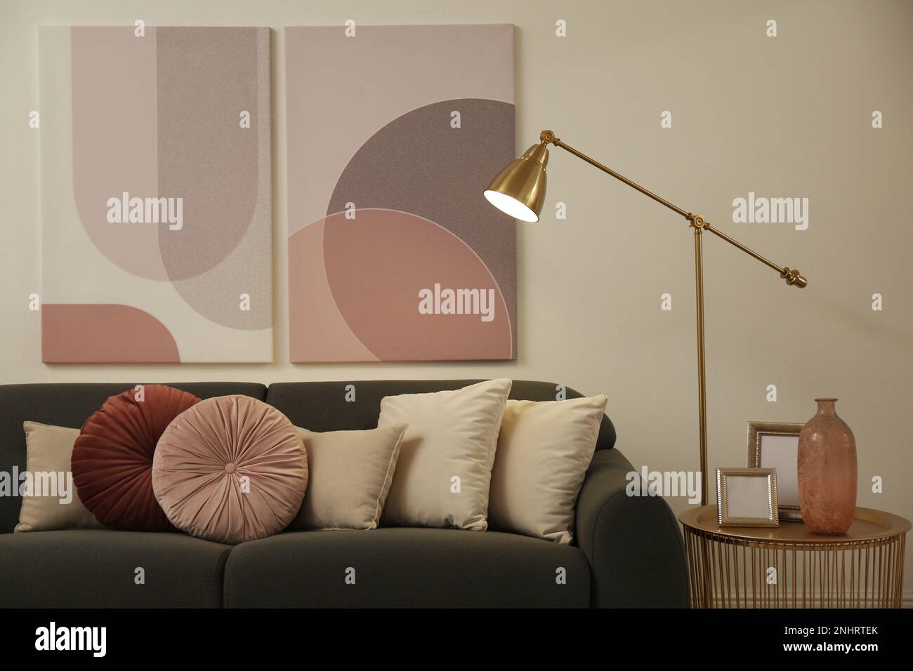 Stylish living room interior with comfortable sofa and floor lamp Stock ...