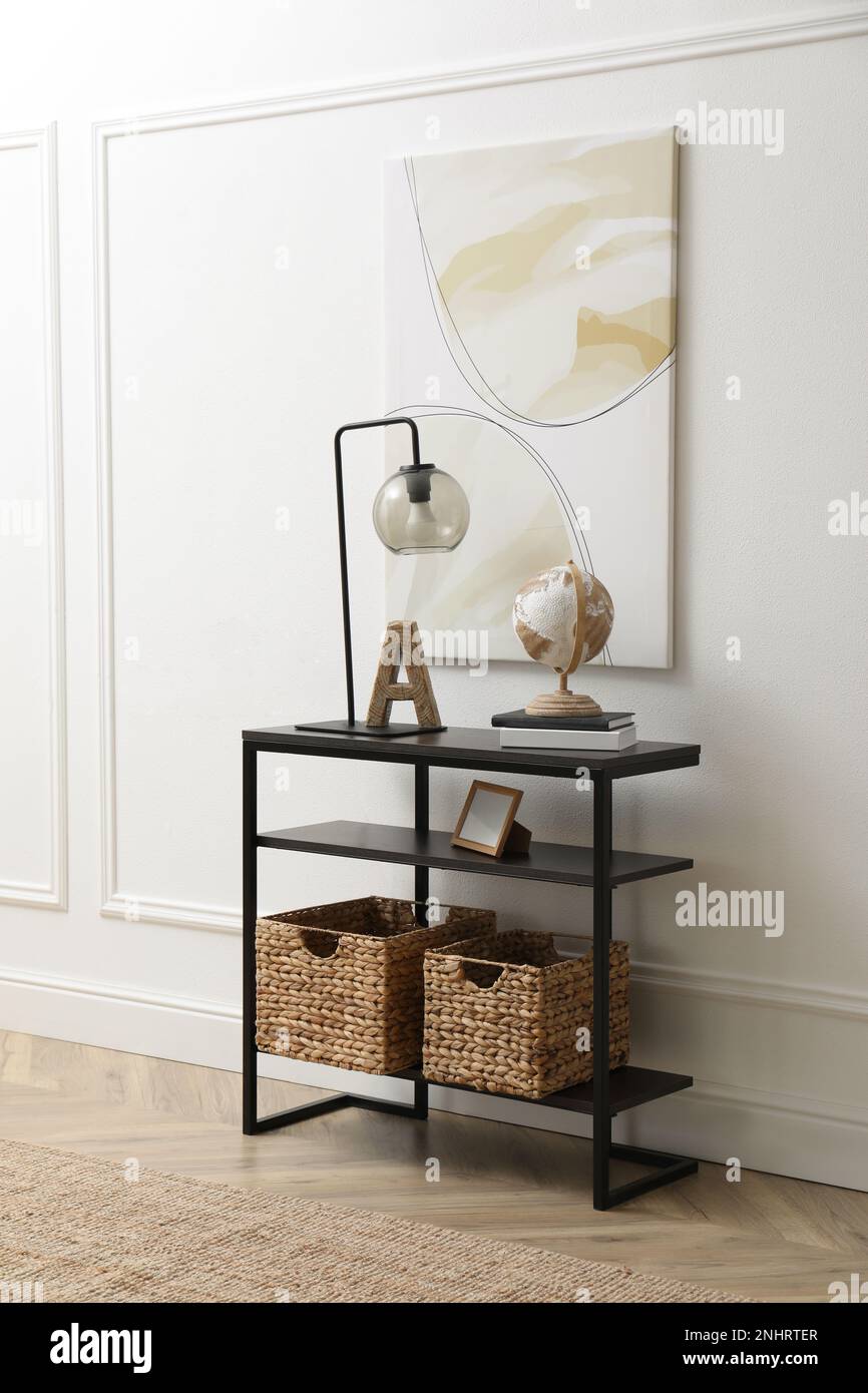 Light hallway interior with stylish console table Stock Photo - Alamy