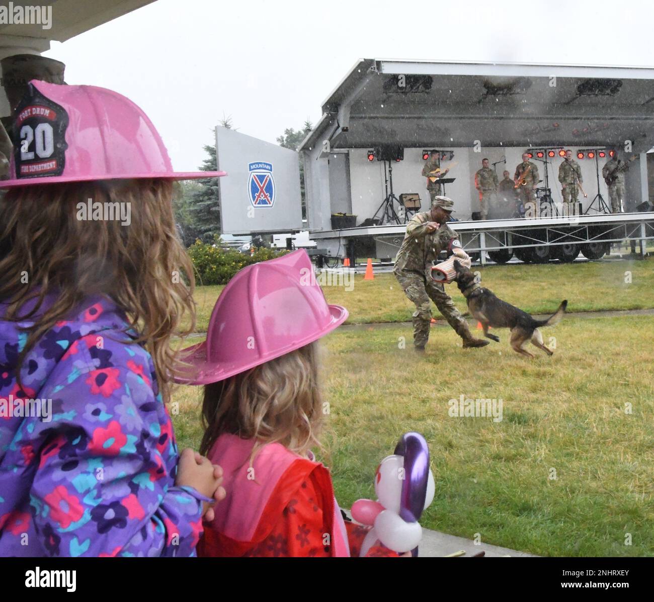 Fort Drum community members watch a military working dog team from the