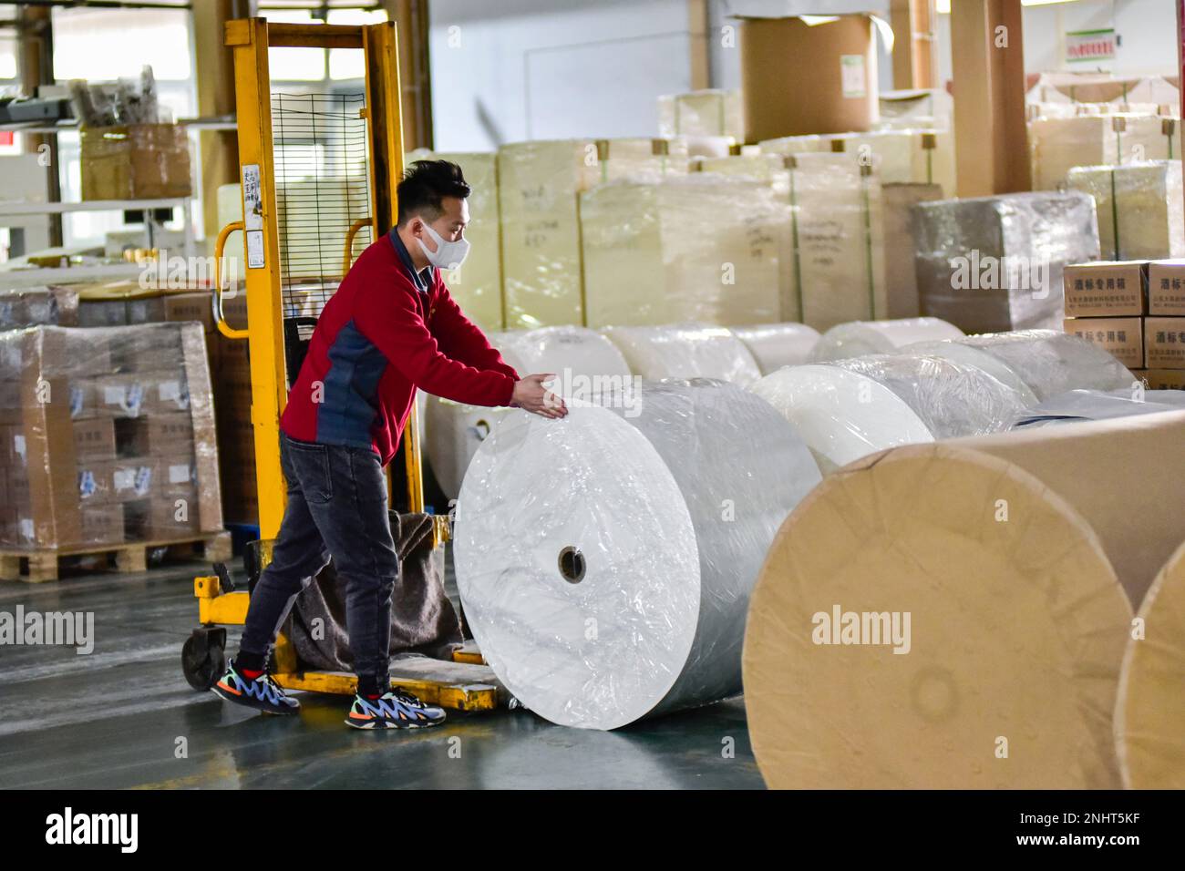 Qingzhou china february 22 2023 a worker sorts raw materials at a