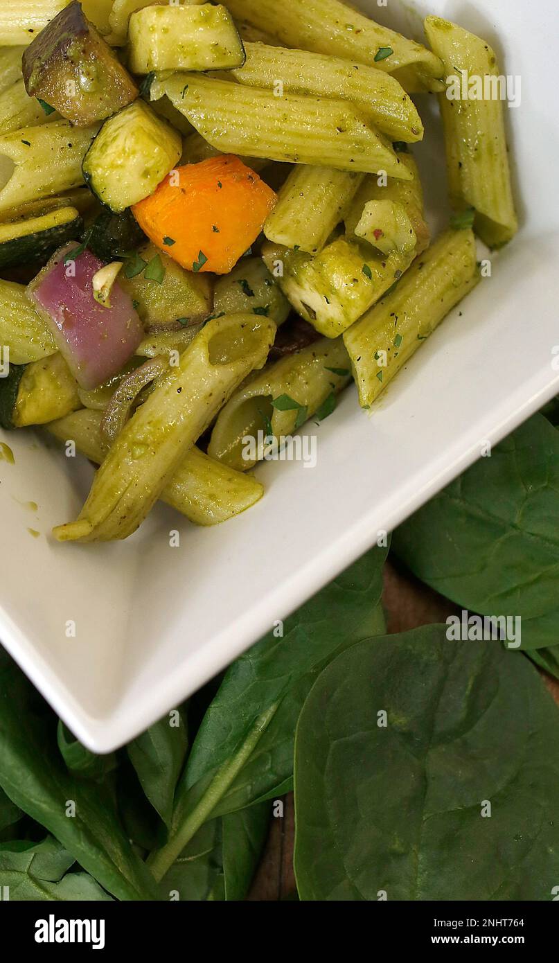 Penne pasta made with spinach and basil pesto served for lunch at Dominican  University of California in San Rafael, California, on Monday, May 4, 2015.  The spinach in the pesto is from