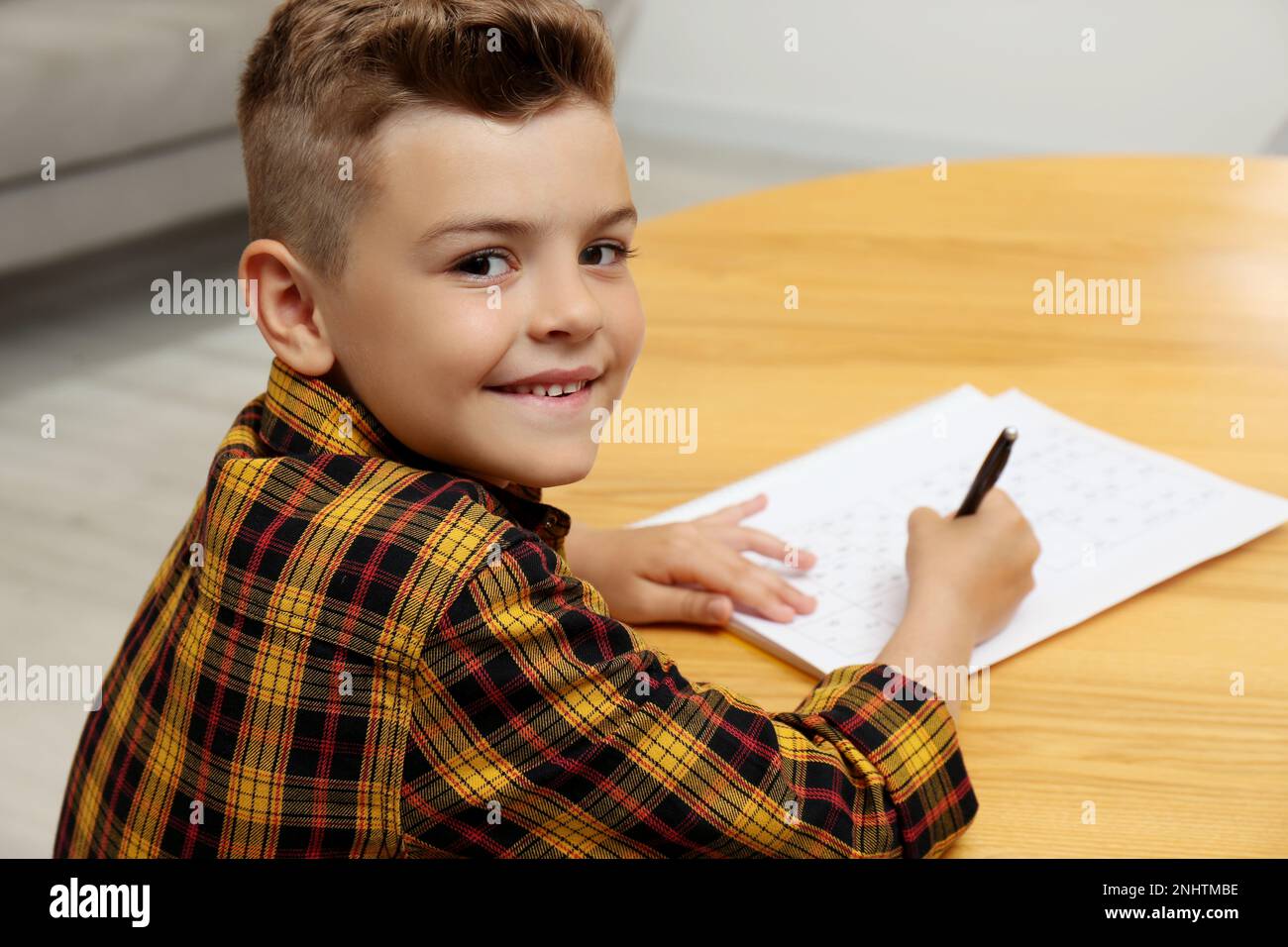 Little Boy Solving Sudoku Puzzle At Table Indoors Stock Photo Alamy Little boy solving sudoku puzzle at table indoors stock photo alamy