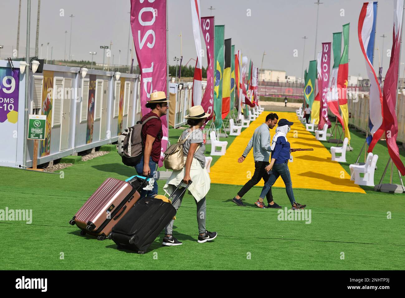 Two soccer fans check in a fan village near the Ahmad Bin Ali Stadium