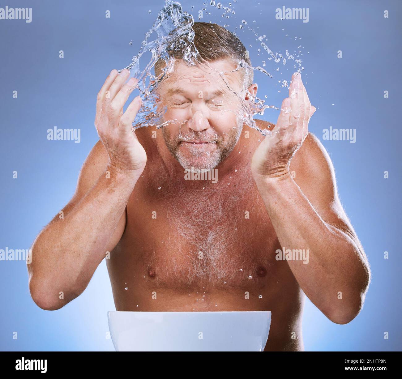 Man cleaning face, hands and water with hygiene and grooming with clean