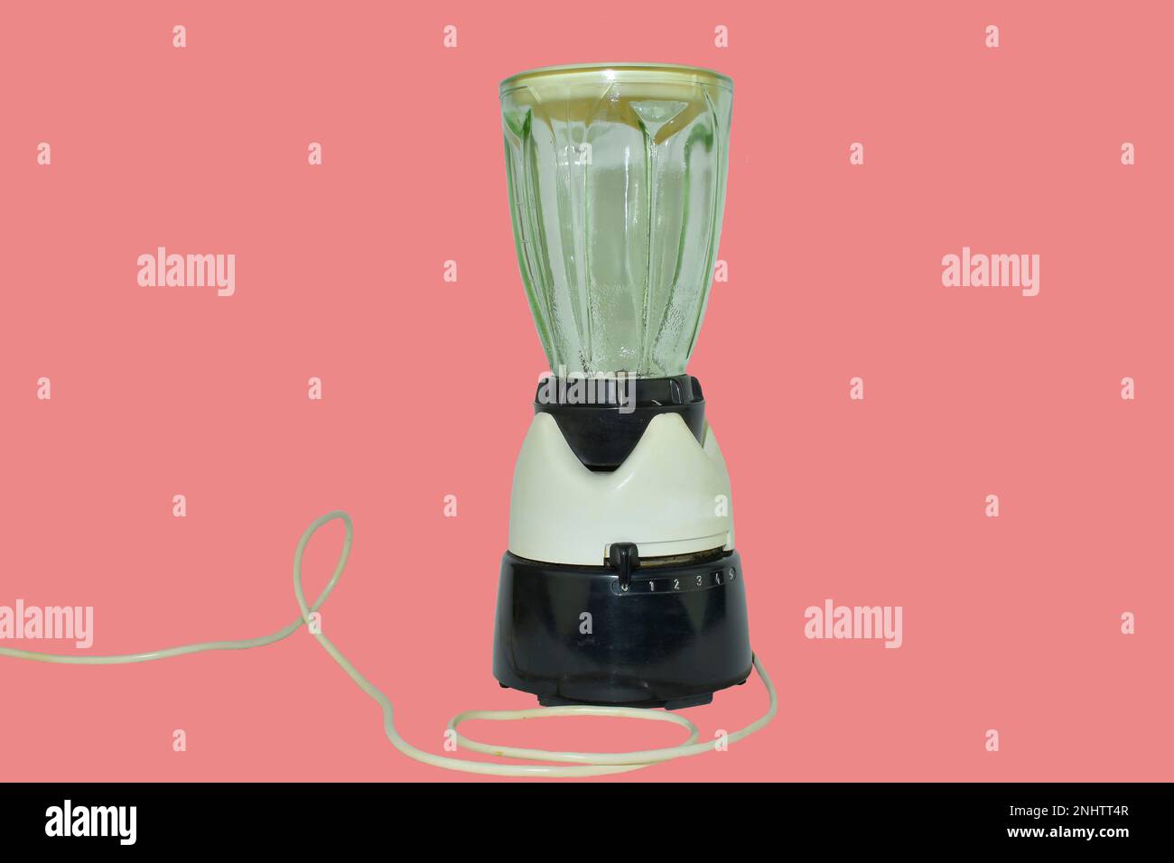 Retro electric blender isolated on very soft red background. Vintage