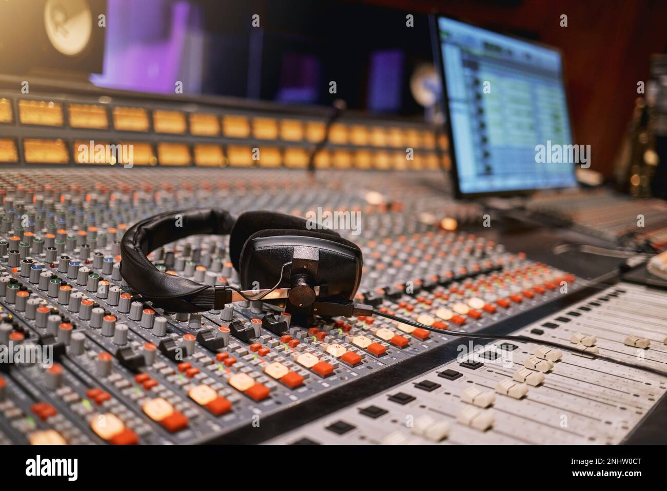 Sound board, music and production with headphones in recording studio with creativity and audio equipment. Mixing console, dj and technology with art Stock Photo