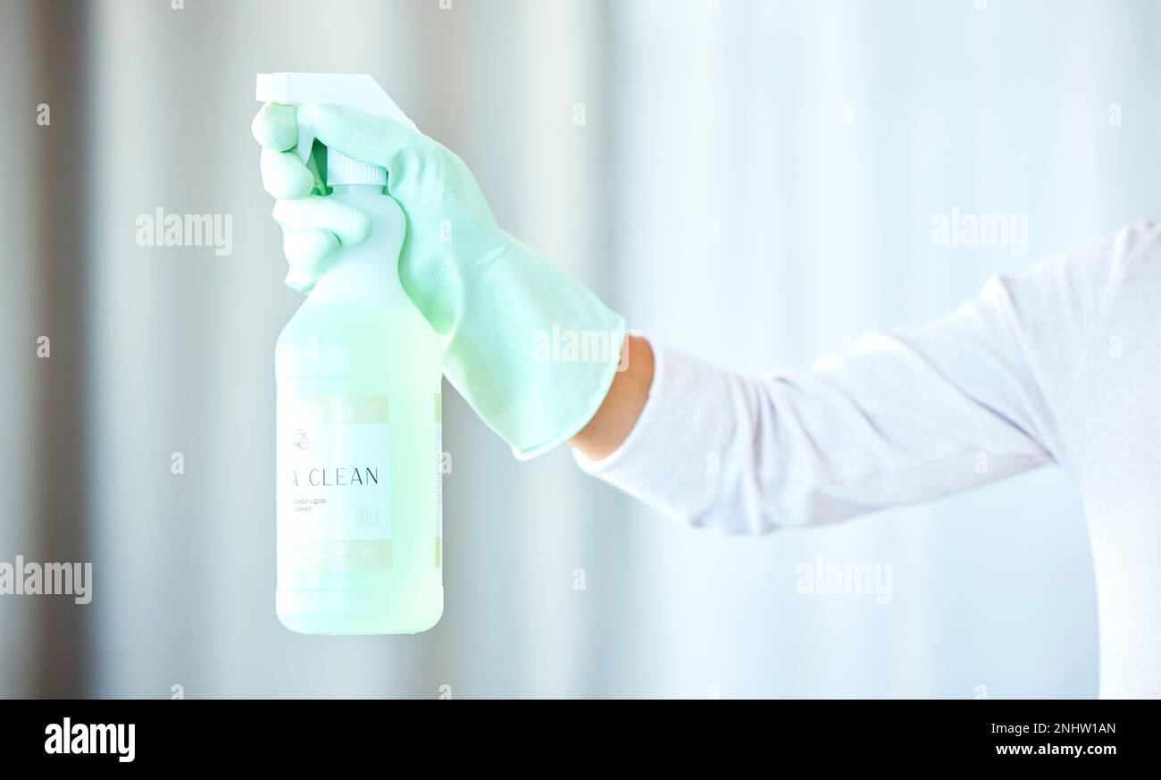 Bottle in hand, arm and spray for cleaning, cleaner and housekeeping