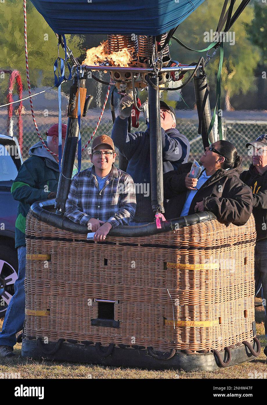 Yuma Sun graphics designer Saul Ramirez, left foreground, is about to