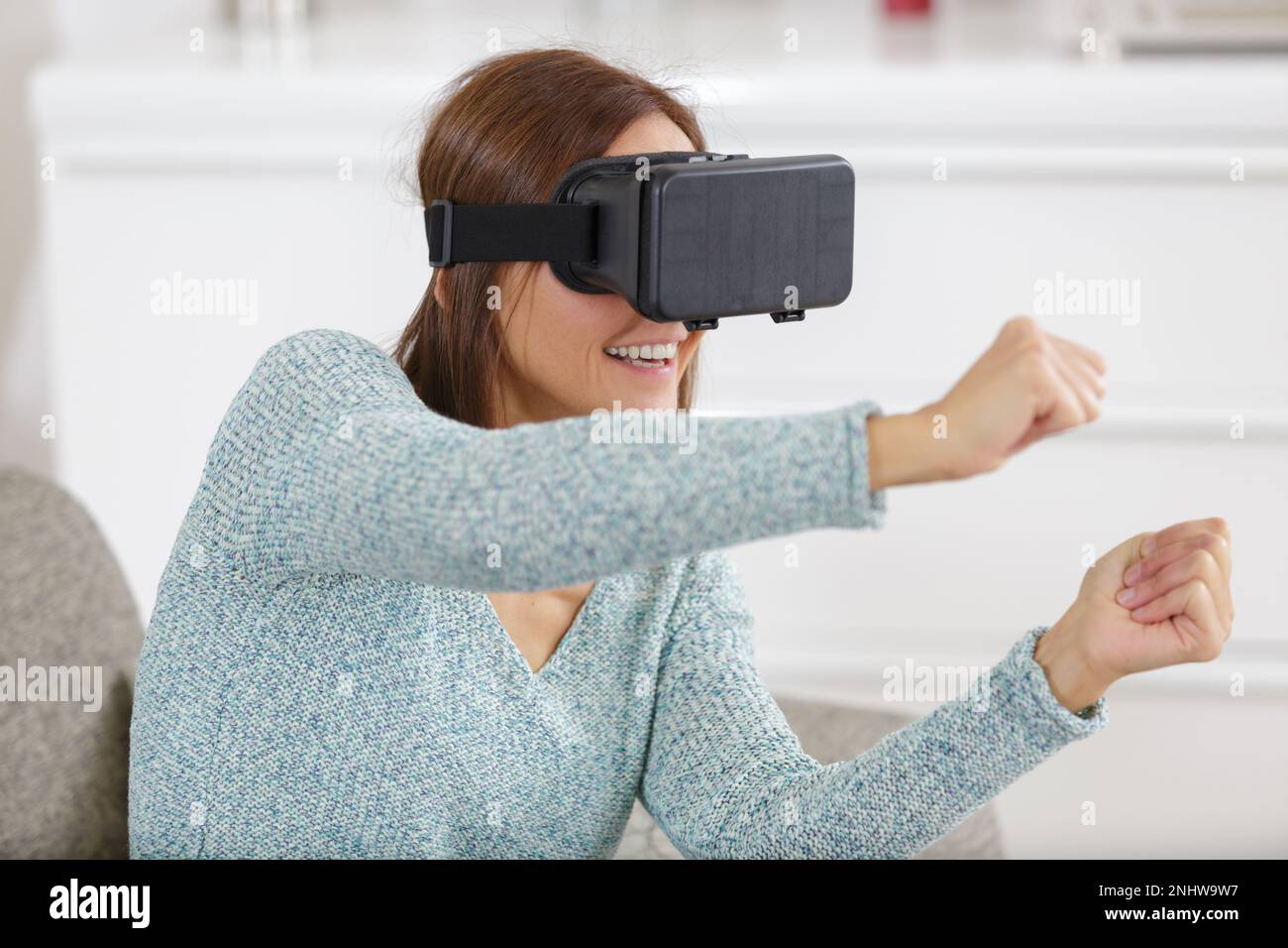 Surprised young woman using hi-res stock photography and images - Alamy