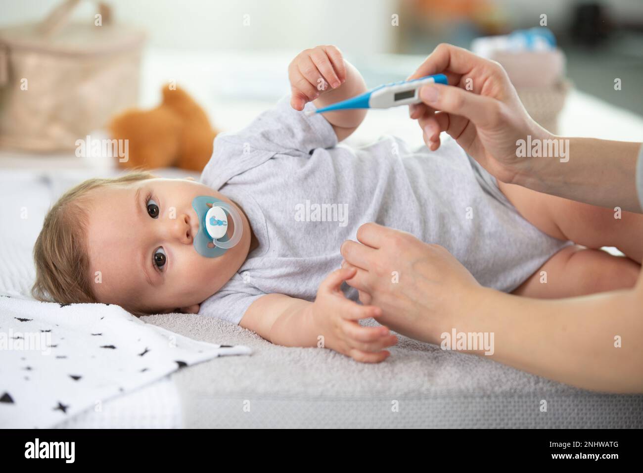 doctor taking baby s temperature close up Stock Photo