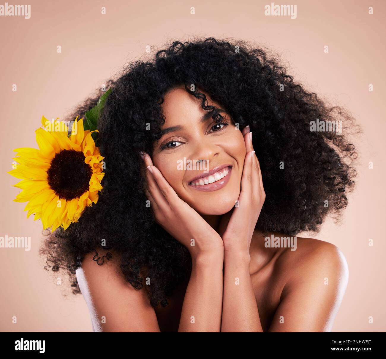 Black woman, studio portrait and sunflower with skincare, beauty or ...