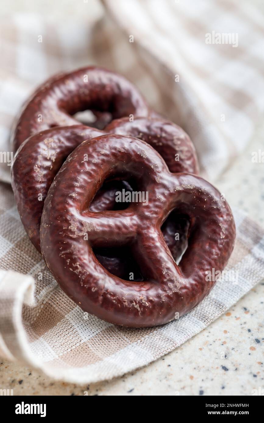 Sweet chocolate pretzels on the checkered napkin. Stock Photo