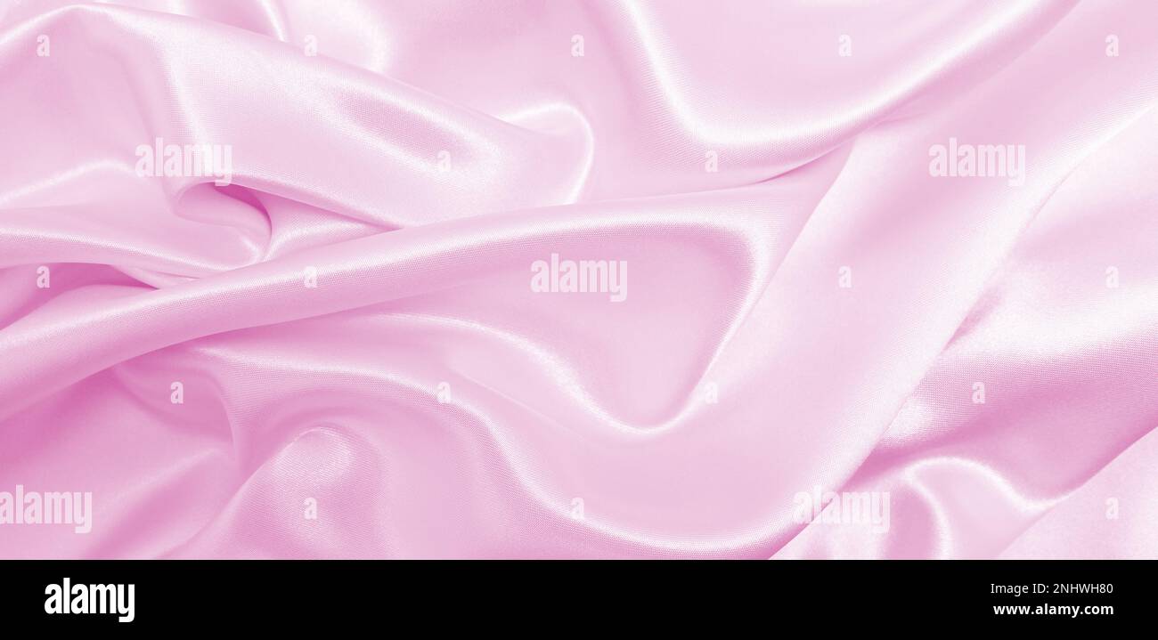 Smooth elegant pink silk or satin texture can use as wedding background ...