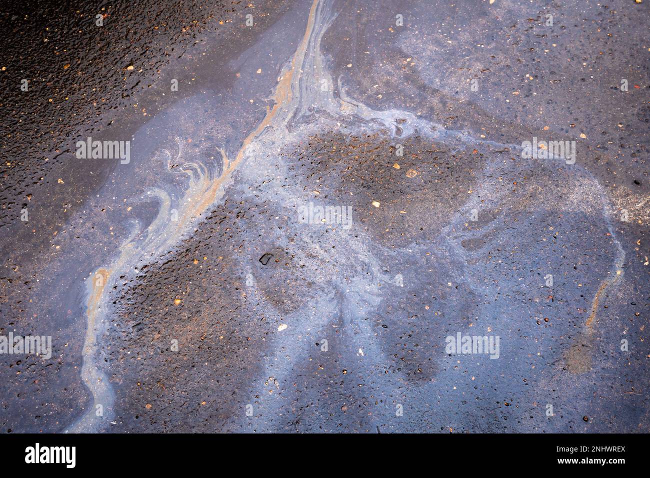 Gasoline stain on the roadway. Oil petrol water pollution Stock Photo ...