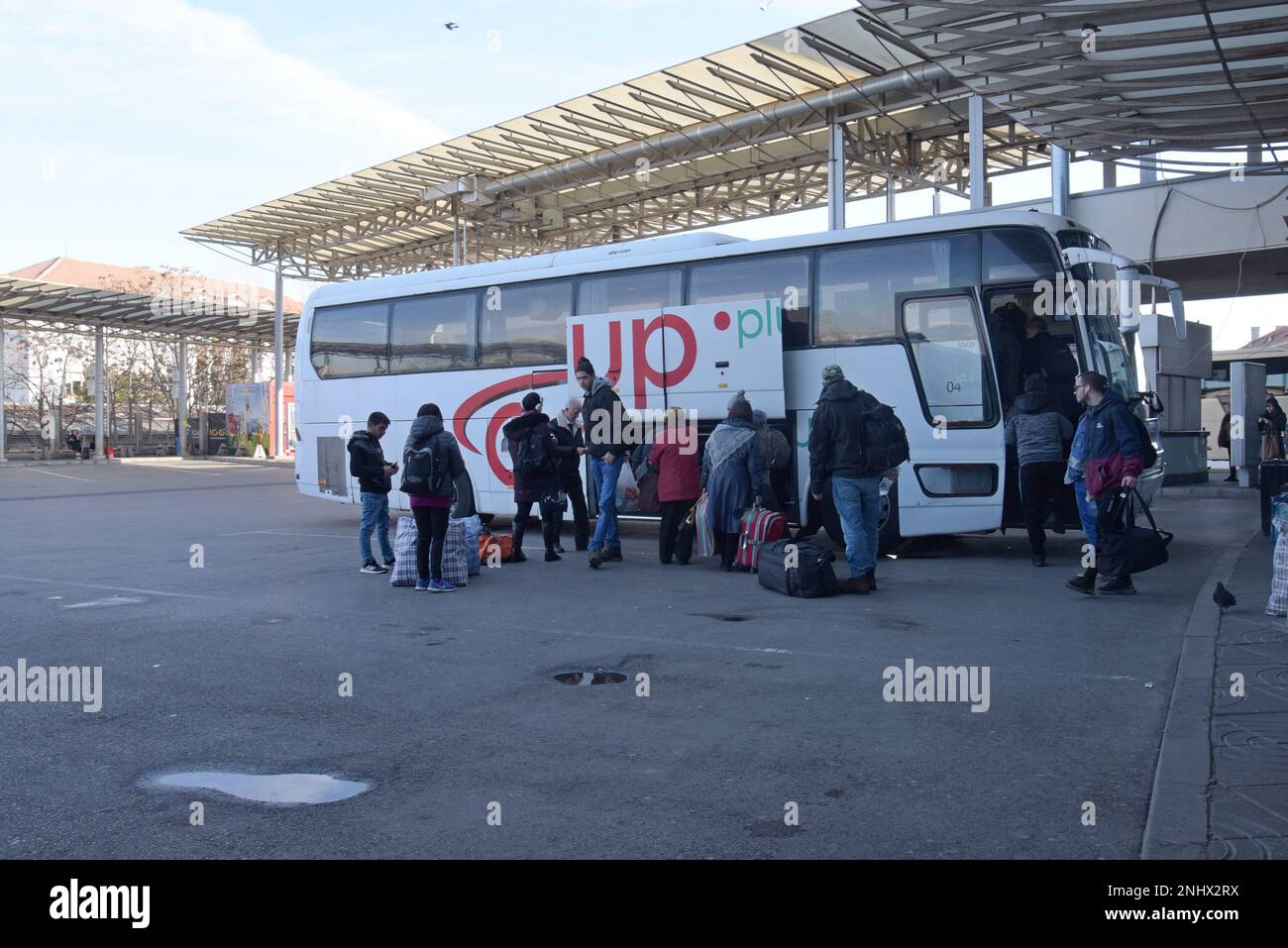 Passengers getting on long distance buses at Sofia central bus station, Bulgaria Stock Photo Alamy