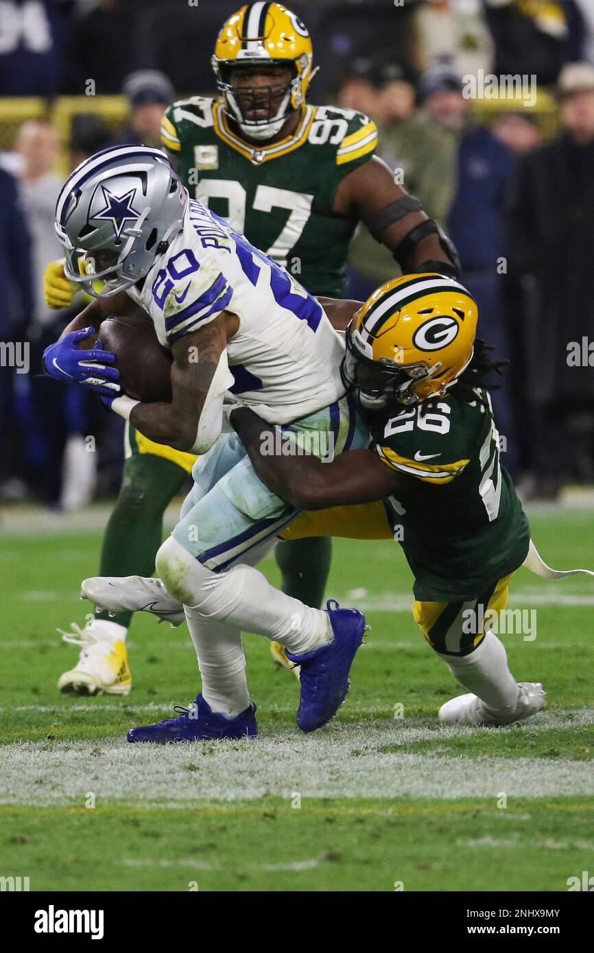 GREEN BAY, WI - NOVEMBER 13: Green Bay Packers safety Darnell Savage (26)  tackles Dallas Cowboys running back Tony Pollard (20) during a game between  the Green Bay Packers and the Dallas