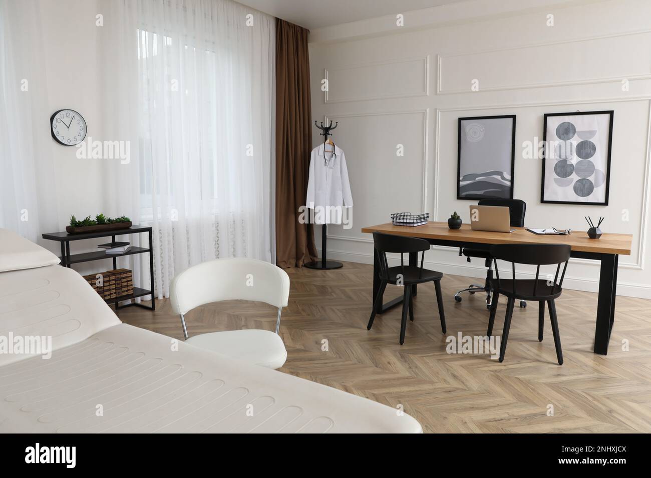 Modern medical office interior with doctor's workplace and examination ...