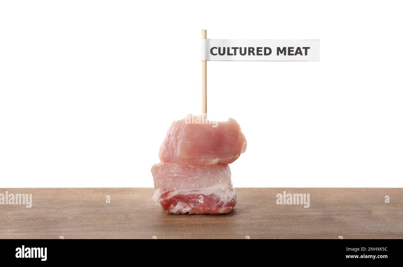 Toothpick Meat Pieces of raw cultured meat with toothpick label on wooden table ...