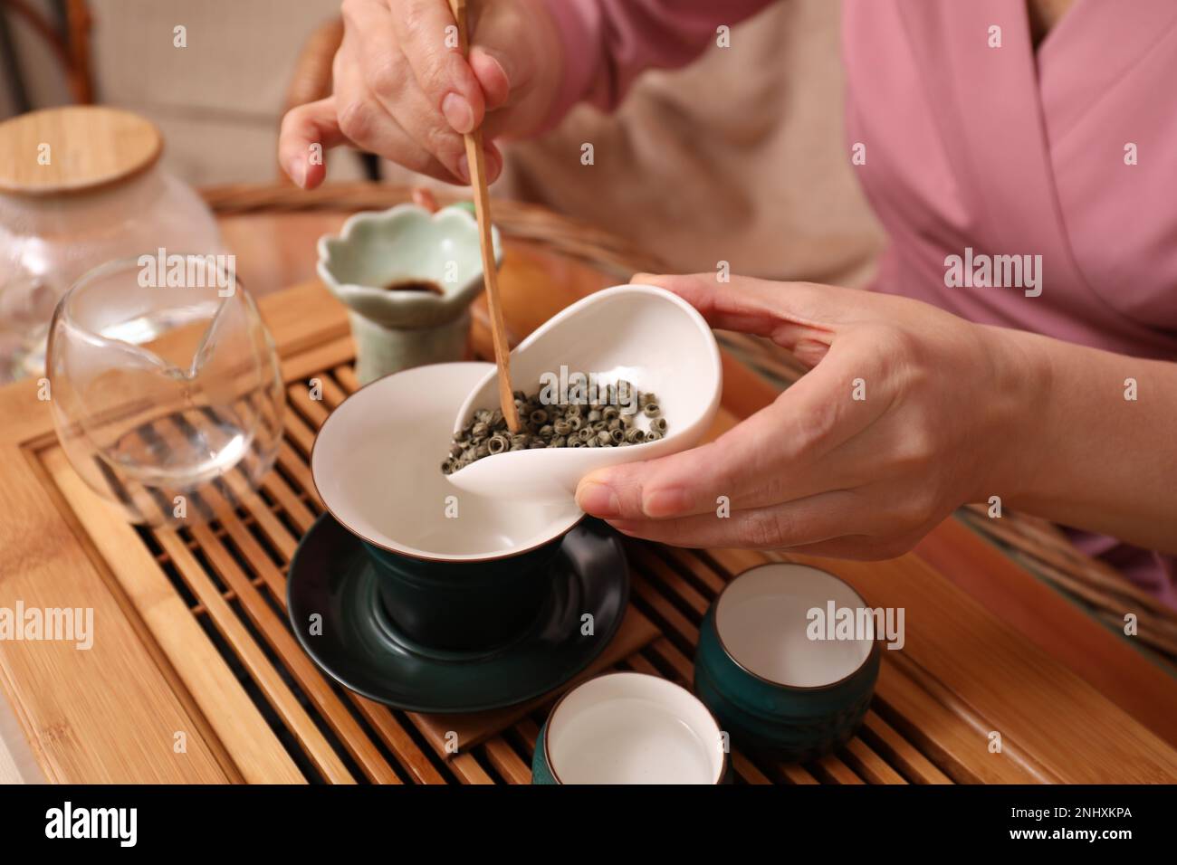 Master conducting traditional tea ceremony at table, closeup Stock