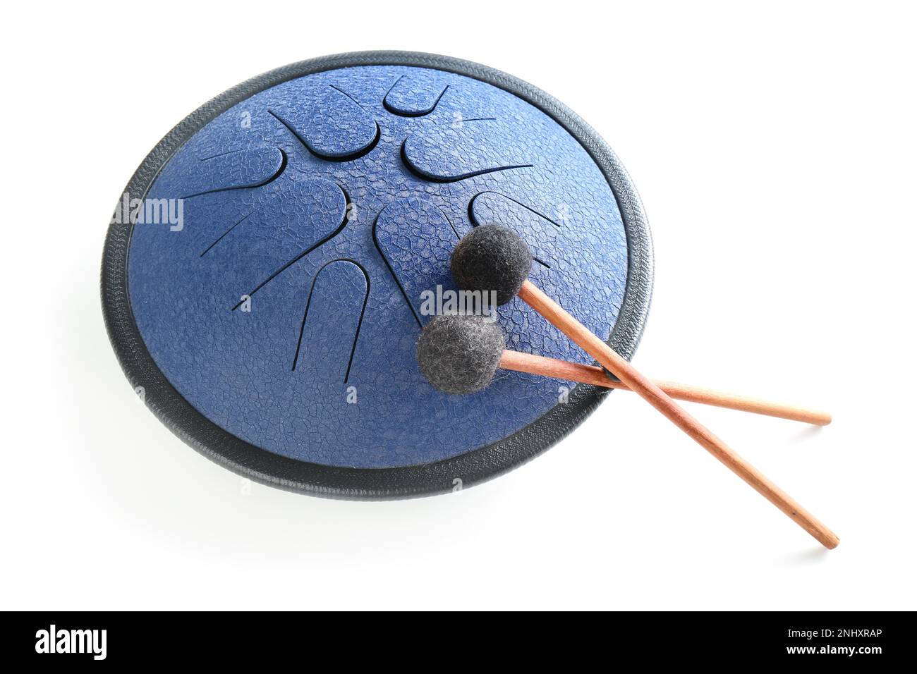 Steel tongue drum with soft mallets on white background. Percussion