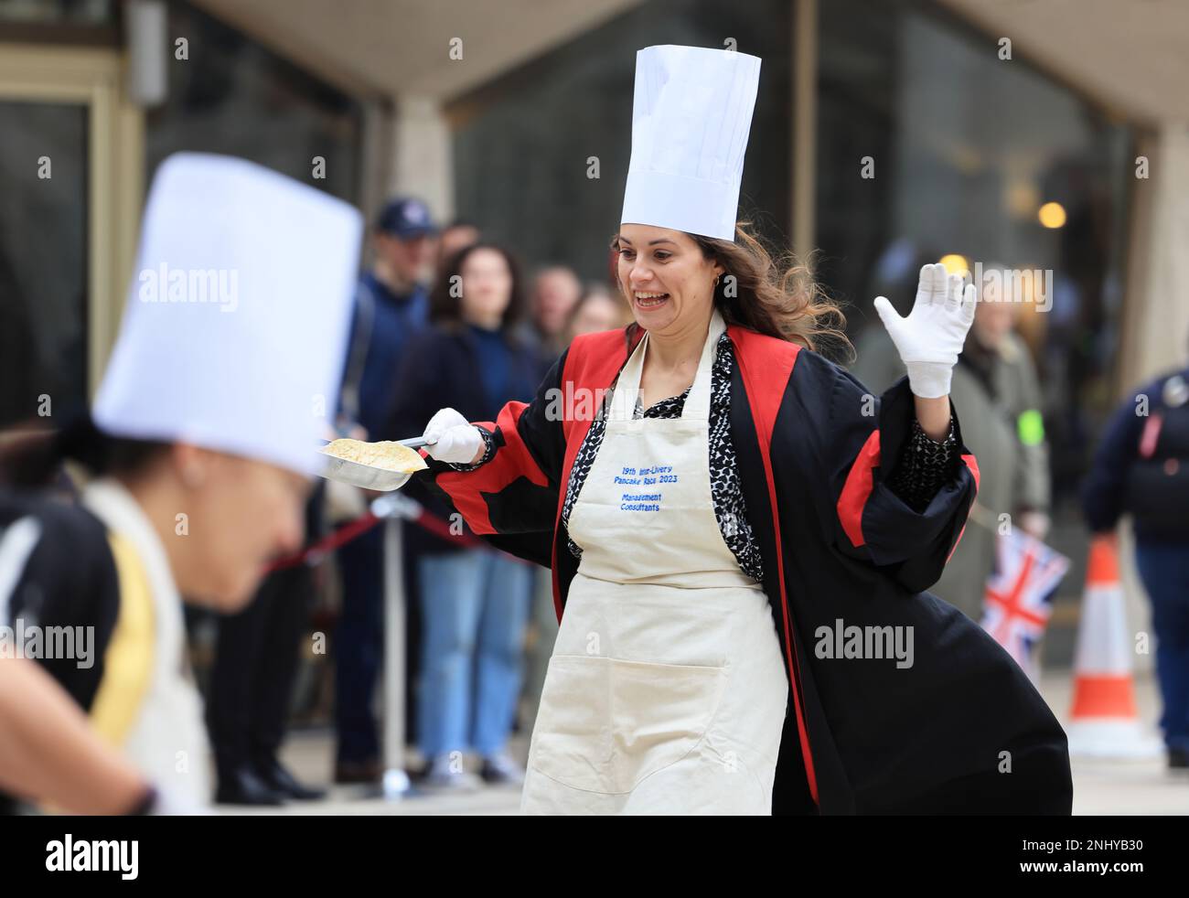 The quirky Inter Livery Pancake Race hosted by the Worshipful Company of Poulters, at Guildhall Yard, for Shrove Tuesday, 2023, in the Square Mile, London, UK Stock Photo