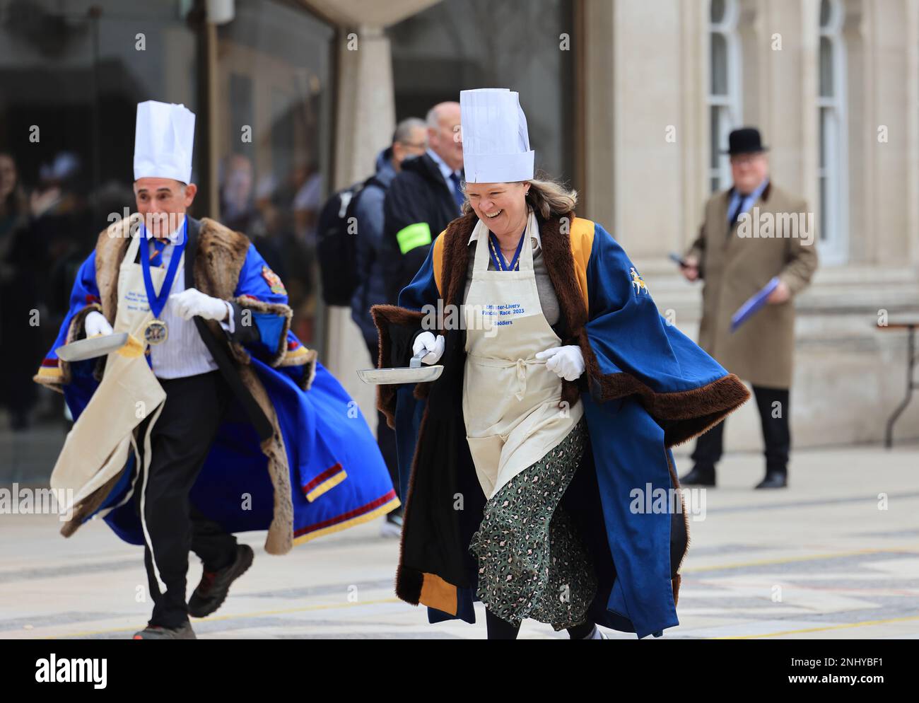 The quirky Inter Livery Pancake Race hosted by the Worshipful Company of Poulters, at Guildhall Yard, for Shrove Tuesday, 2023, in the Square Mile, London, UK Stock Photo
