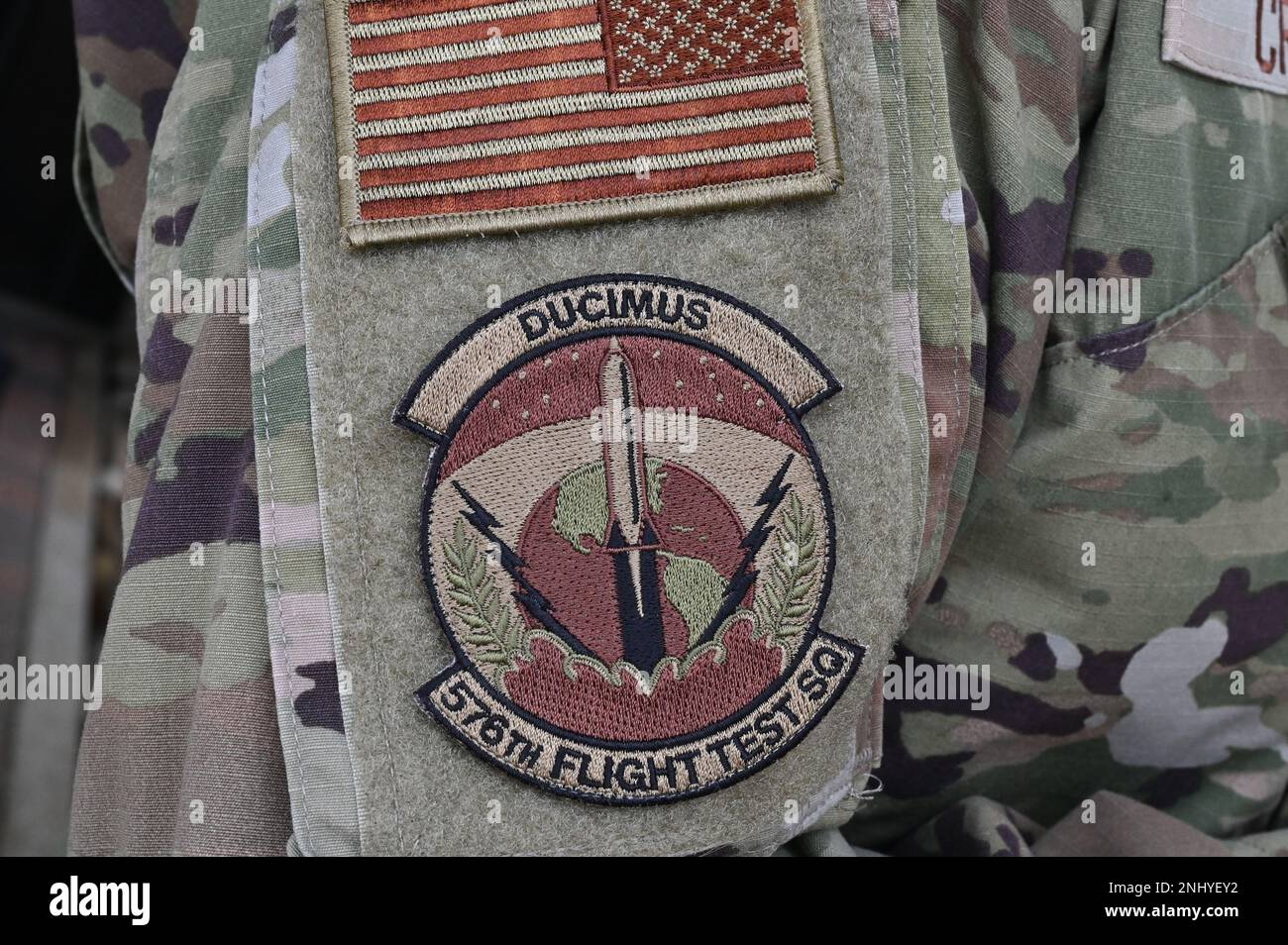 The 576th Flight Test Squadron patch is displayed on an Airman’s arm at Vandenberg Space Force Base, California, Aug. 3, 2022. Leadership from Kirtland Air Force Base visited Vandenberg during a “move the flag” visit. Stock Photo