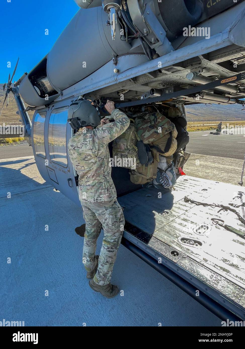A 301st Rescue Squadron Special Mission Aviator prepares an HH60G Pave