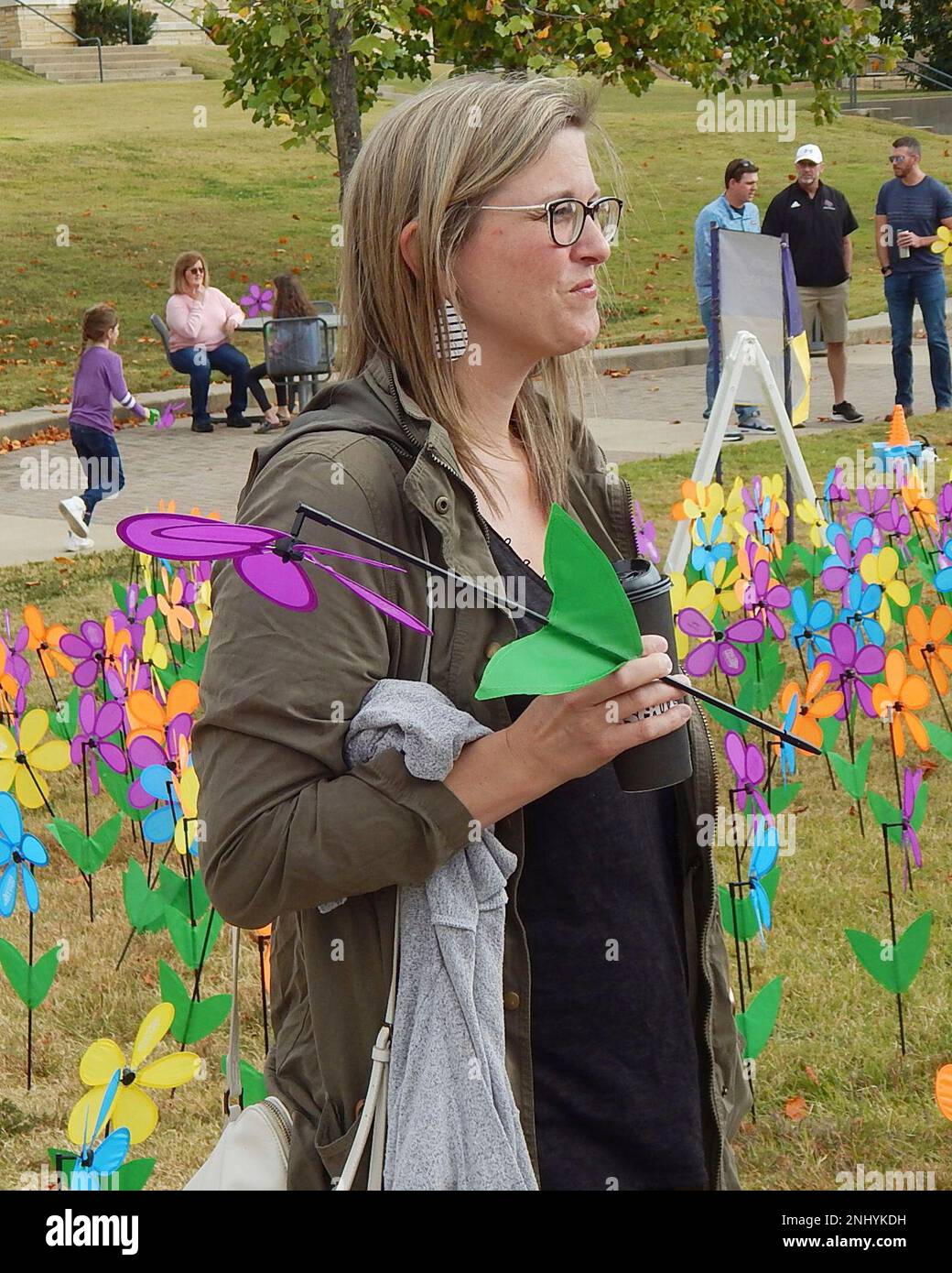 Olivia Stone of Jonesboro stands amid the paper flower petals that ...
