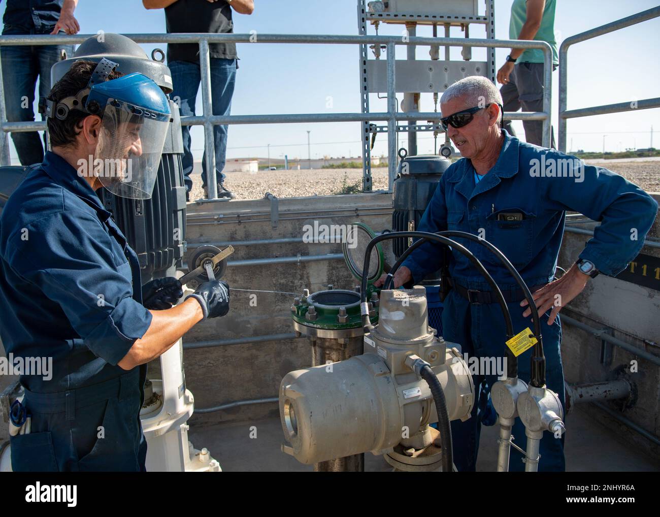 Juan Barrera Crespo (left), Naval Supply Systems Command Fleet