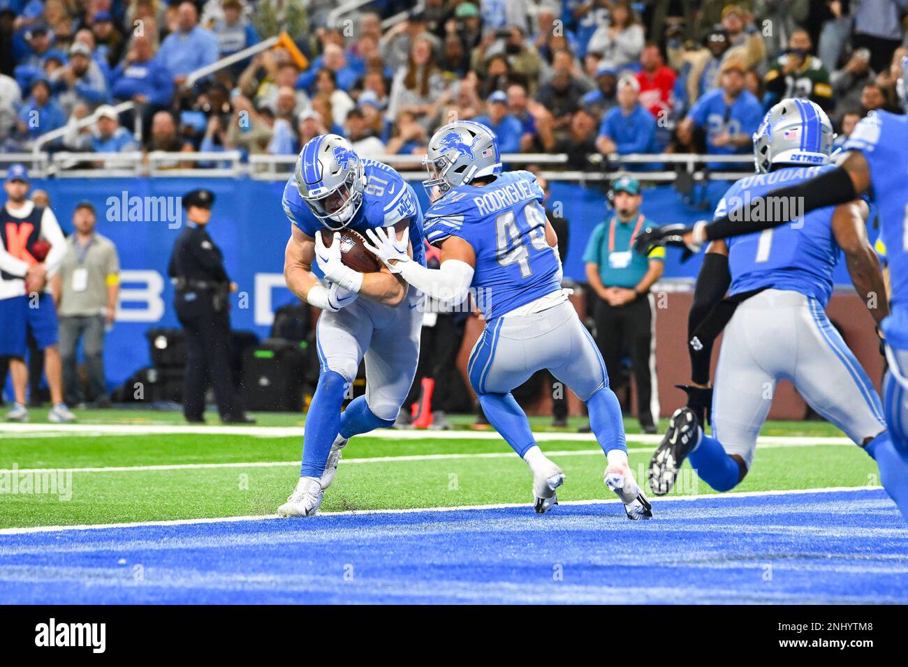 DETROIT, MI - NOVEMBER 06: Detroit Lions defensive end Aidan Hutchinson  (97) makes an interception in the end zone during the Detroit Lions versus  the Green Bay Packers game on Sunday November