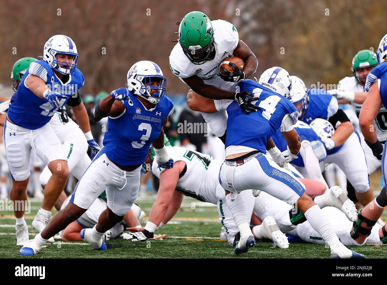 TERRE HAUTE, IN - NOVEMBER 05: North Dakota Fighting Hawks running back  Isaiah Smith (29) tires to jump over Indiana State Sycamores defensive back  Kaleal Davis (14) during a College football game