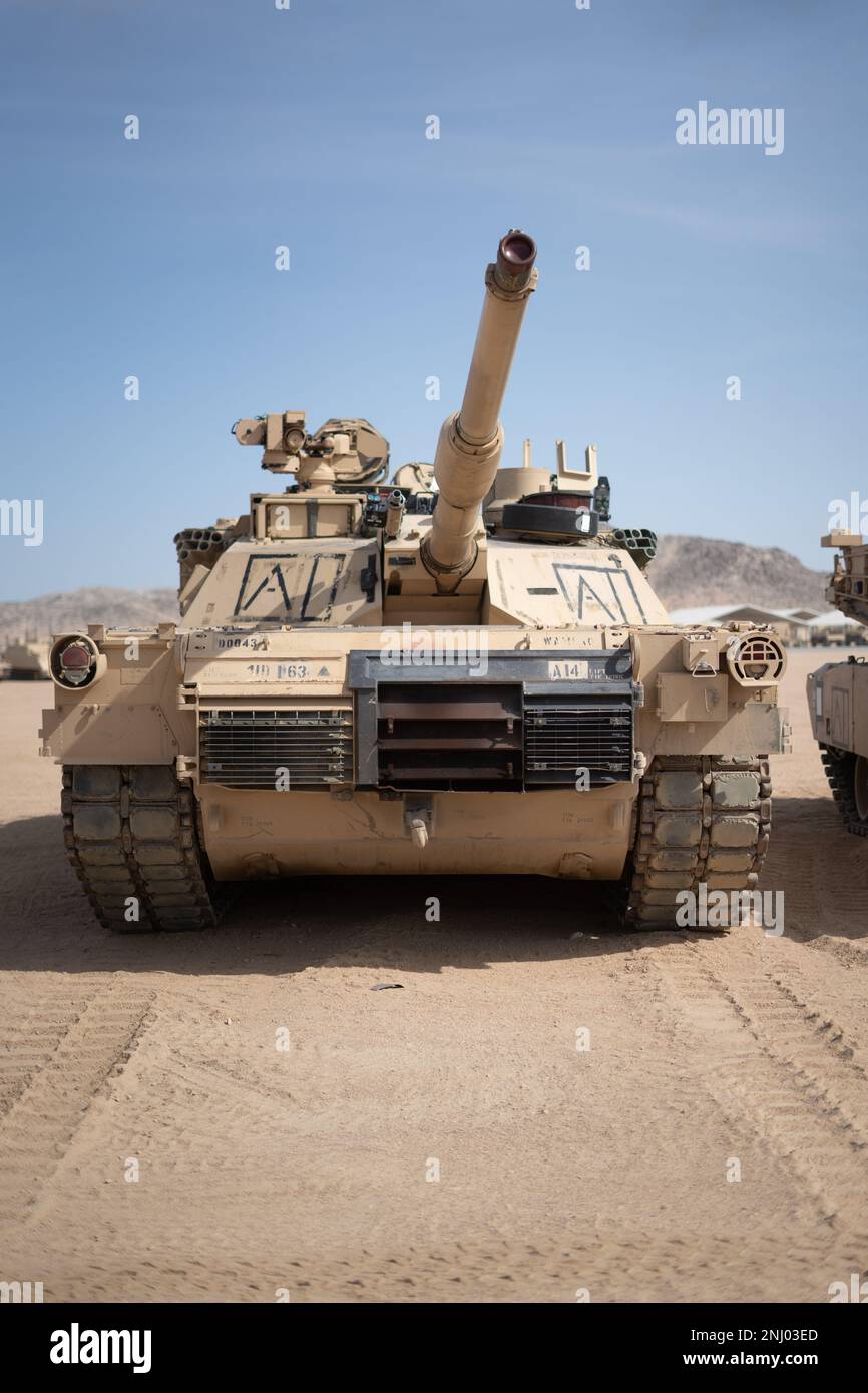 U.S. Soldiers assigned to 1st Battalion, 63rd Infantry Regiment, 2nd Armored Brigade Combat Team, 1st Infantry Division installed Multiple Integrated Laser Engagement System (MILES) on a M1 Abrams tank during Decisive Action Rotation 22-09 at the National Training Center, Fort Irwin, Calif., Aug. 3, 2022. Stock Photo