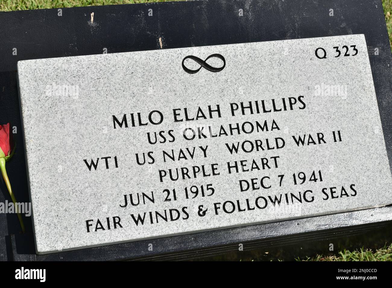 A gravestone dedicated to U.S. Navy Water Tender 1st Class Milo E. Phillips sits at the National Memorial Cemetery of the Pacific, Honolulu, Hawaii, August 4, 2022. Phillips was assigned to the USS Oklahoma, which capsized after sustaining multiple hits from Japanese aircraft and torpedoes, causing the deaths of more than 400 crew members on Dec. 7, 1941, at Ford Island, Pearl Harbor. Stewart was recently identified through DNA analysis by the Defense POW/MIA Accounting Agency (DPAA) forensic laboratory and laid to rest with full military honors. Stock Photo