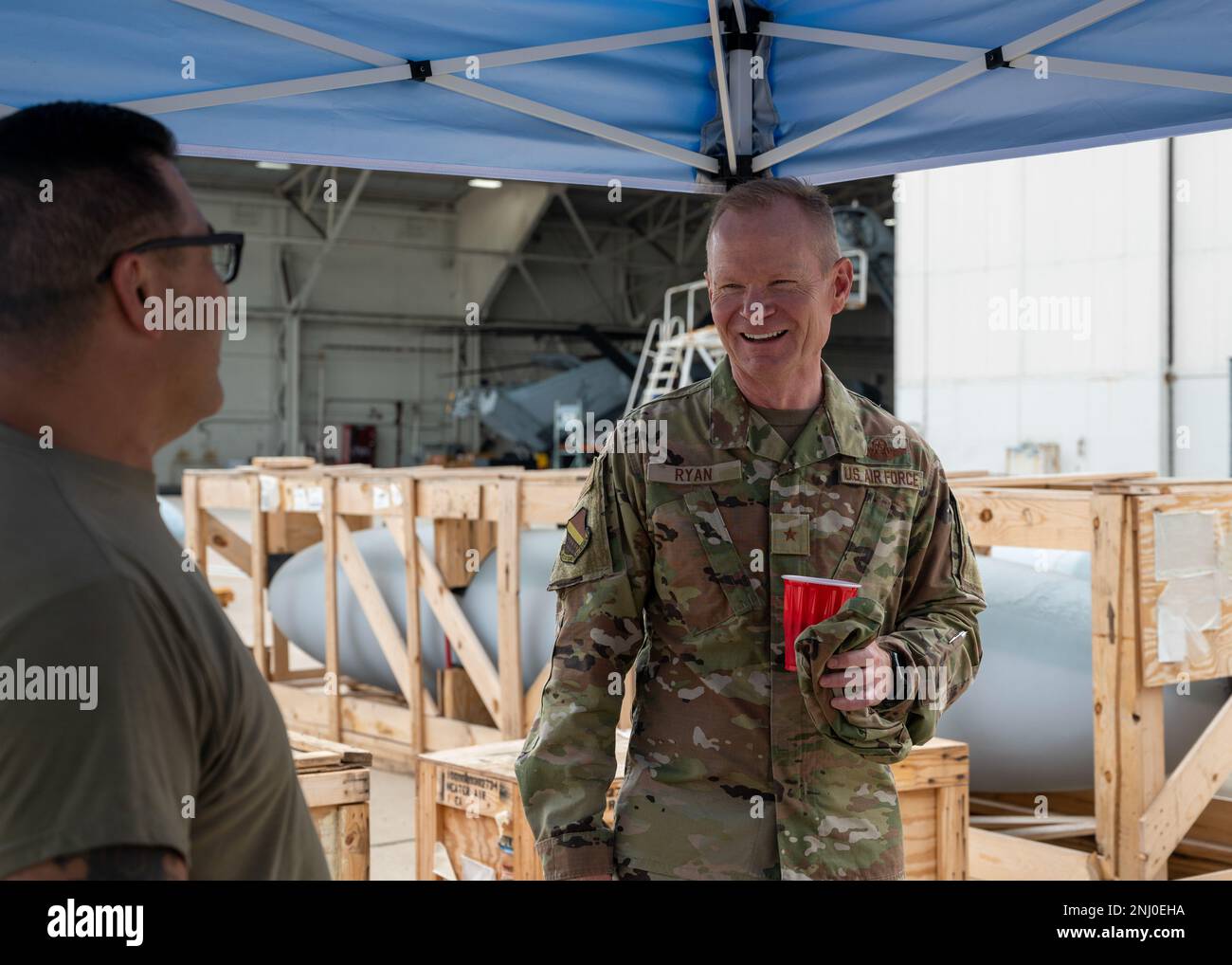 U.S. Air Force Master Sgt.Thomas Skaggs, ammunition technician, 140th Wing, Colorado Air National Guard, laughs with Brig. Gen. Shawn Ryan, Assistant Adjutant General-Air and Commander, Colorado Air National Guard, Buckley Space Force Base, Colorado at Miramar Marine Corp Air Station, on Aug 4, 2022. The 140th Wing is performing aerial maneuvers and training with the F-18 fighter jets, stationed at Miramar Air Station, to enhance their wartime readiness capabilities utilizing the latest combat scenarios. Stock Photo