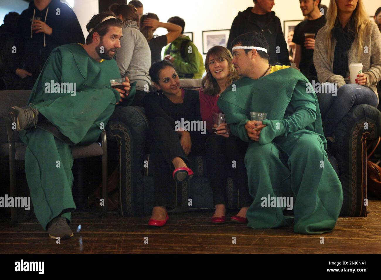Left to right--Nils Marchand, Nada Dorman, Julie Marchand, and Peter Dorman  sit on the couch after they play cornhole at the Sports Basement Grotto in  San Francisco, Calif., at the ZogSports kickoff
