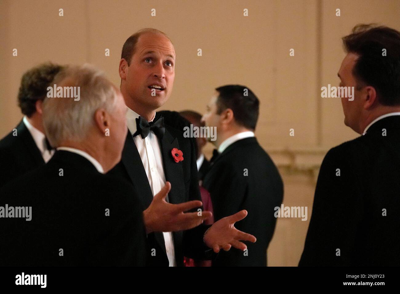 Britain's Prince William speaks to guests as he attends an awards
