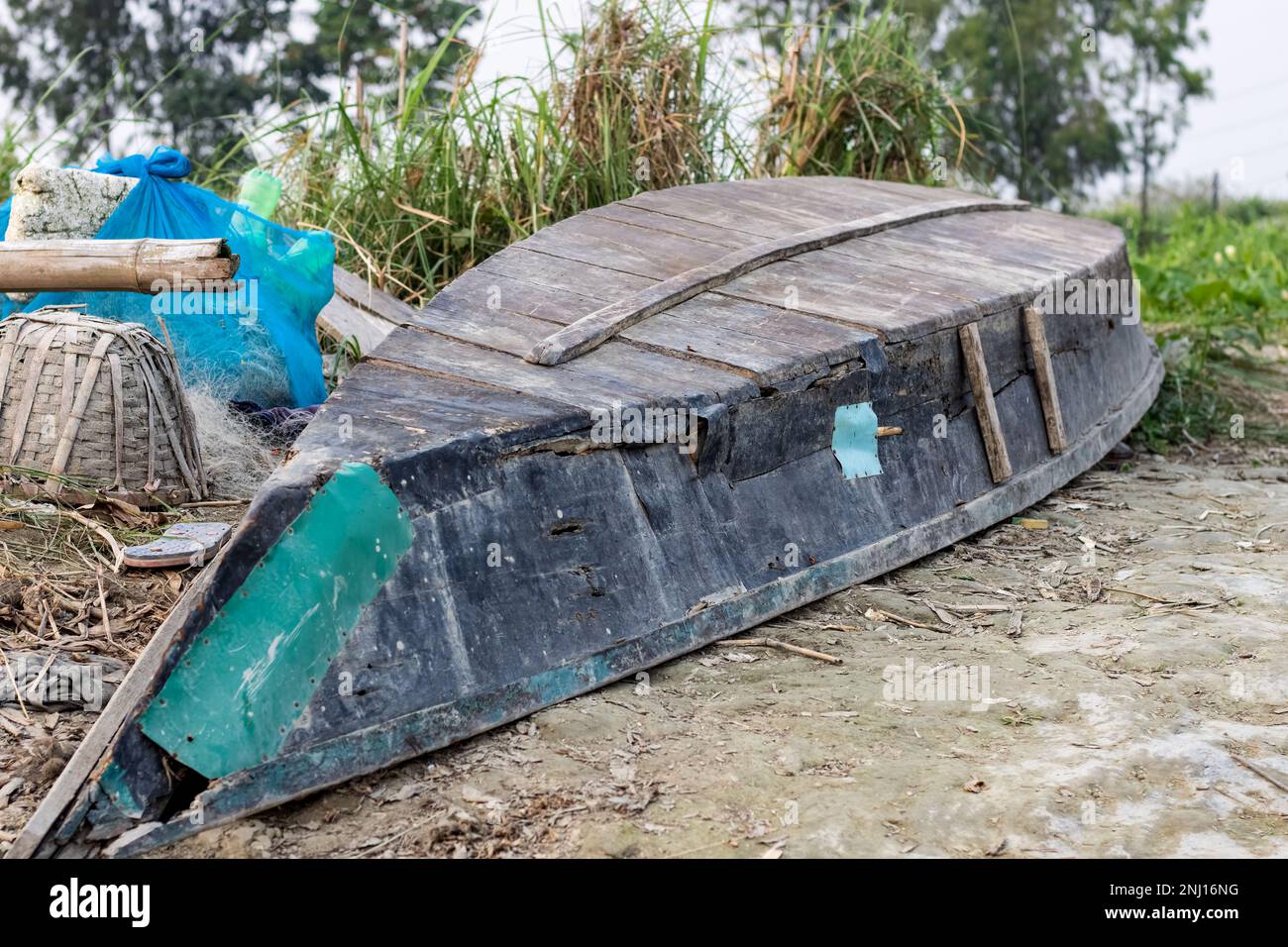 Abandoned wooden fishing boat in rural village Stock Photo - Alamy