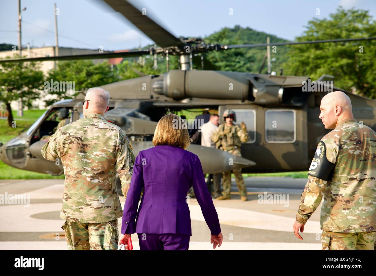 Nancy Pelosi, Speaker of the United States House of Representatives, led a congressional delegation to visit the DMZ/JSA to engage with service members stationed there. Nancy Pelosi boards UH-60M helicopters from Comhawk Flight Detachment with Gen. Paul LaCamera, Commander of U.S. Forces Korea.    Soldiers from B Co., 3-2 General Support Aviation Battalion and Comhawk Flight Detachment supported flying the Speaker of the House and staff on her visit to the DMZ and Osan Airbase on August 4, 2022. Stock Photo
