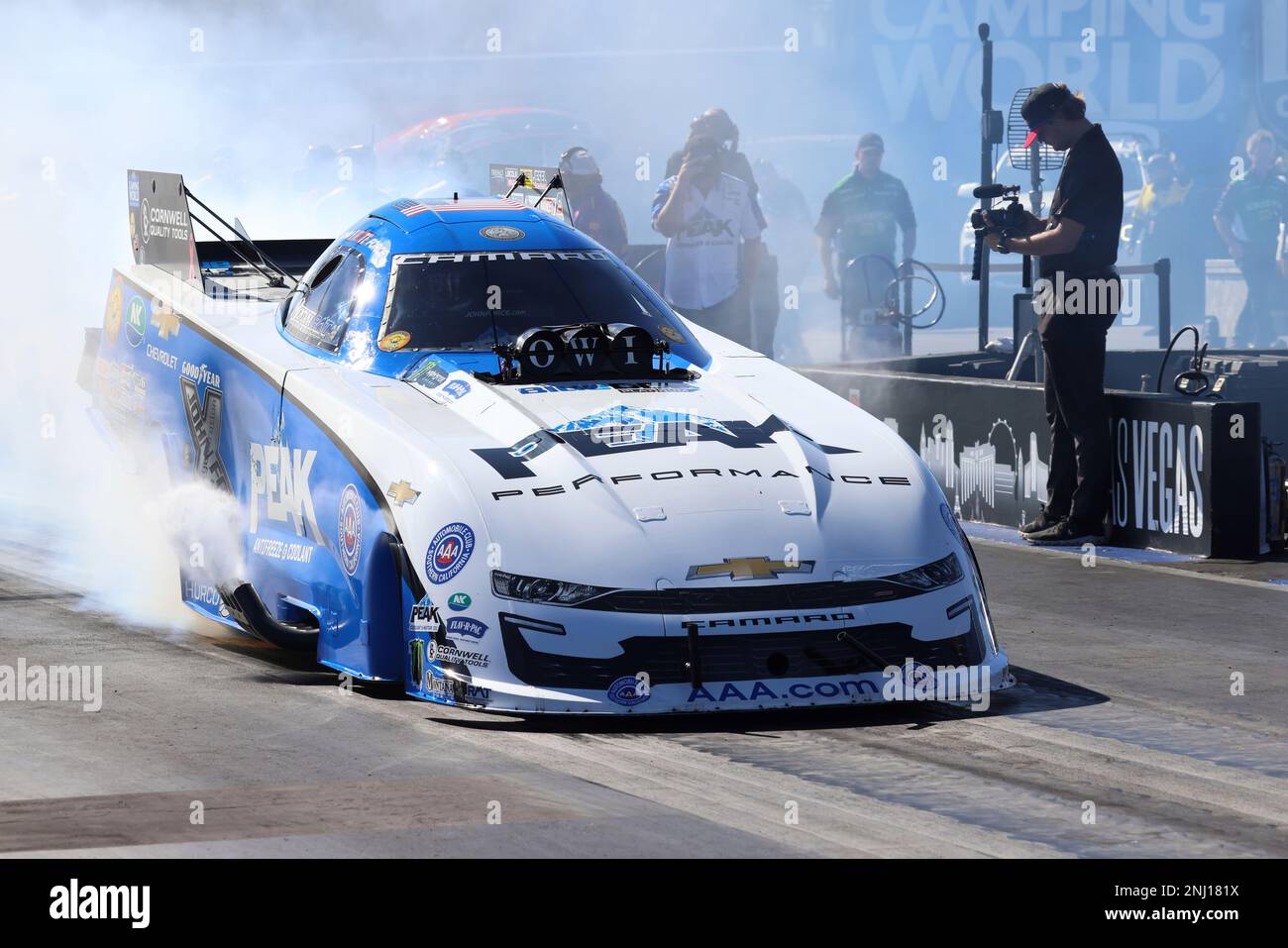 LAS VEGAS, NV - OCTOBER 30: John Force (5 FC) PEAK Chevrolet Camaro SS NHRA  Funny Car does a burnout during the first round of eliminations at the NHRA  Nevada Nationals Sunday,