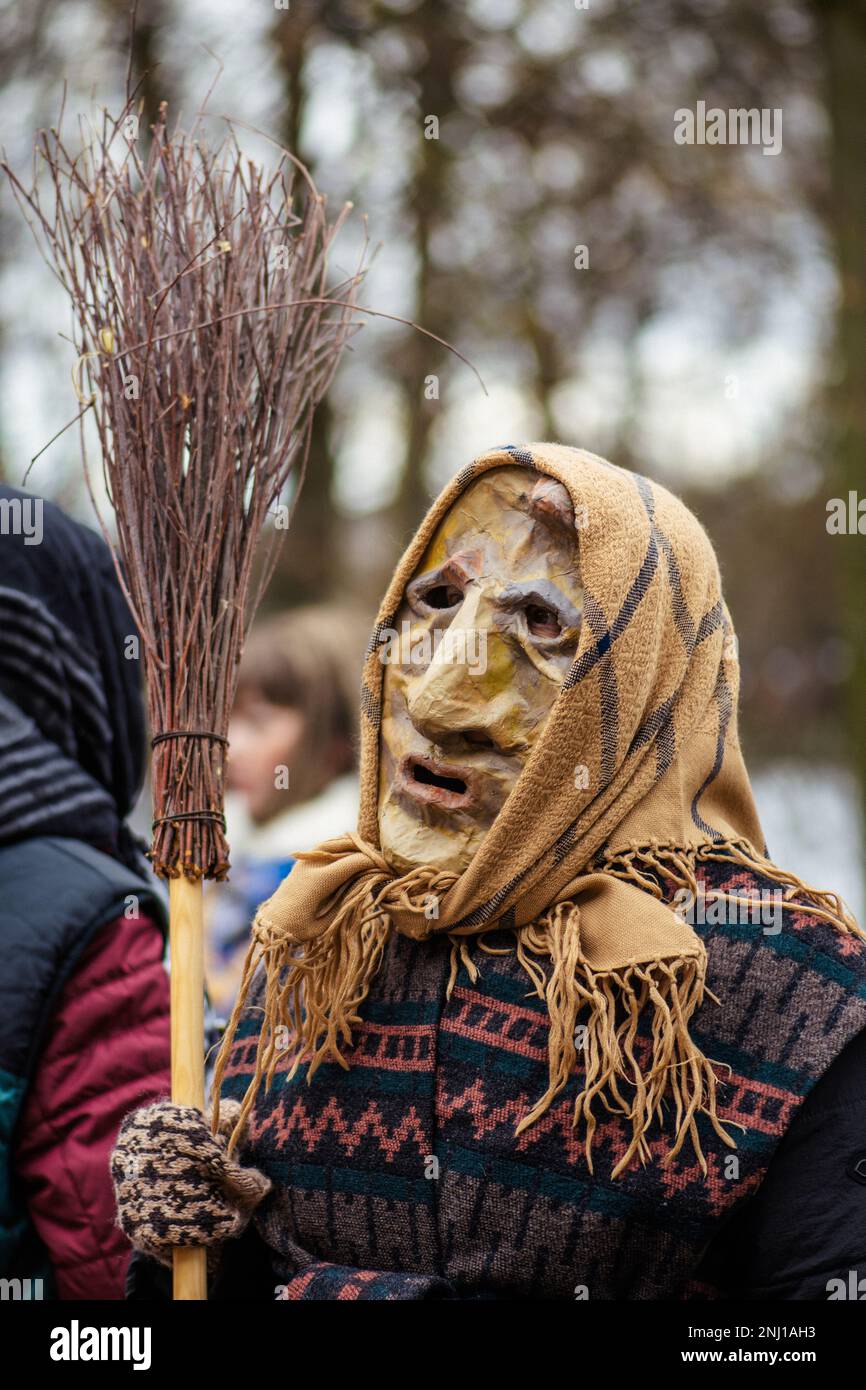 Traditional masks and costumes in Lithuania during Uzgavenes, a Lithuanian folk festival during Carnival, seventh week before Easter, vertical Stock Photo