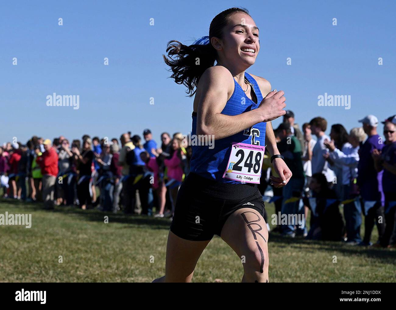 Indianapolis Chatard's Lily Cridge nears the finish line to take