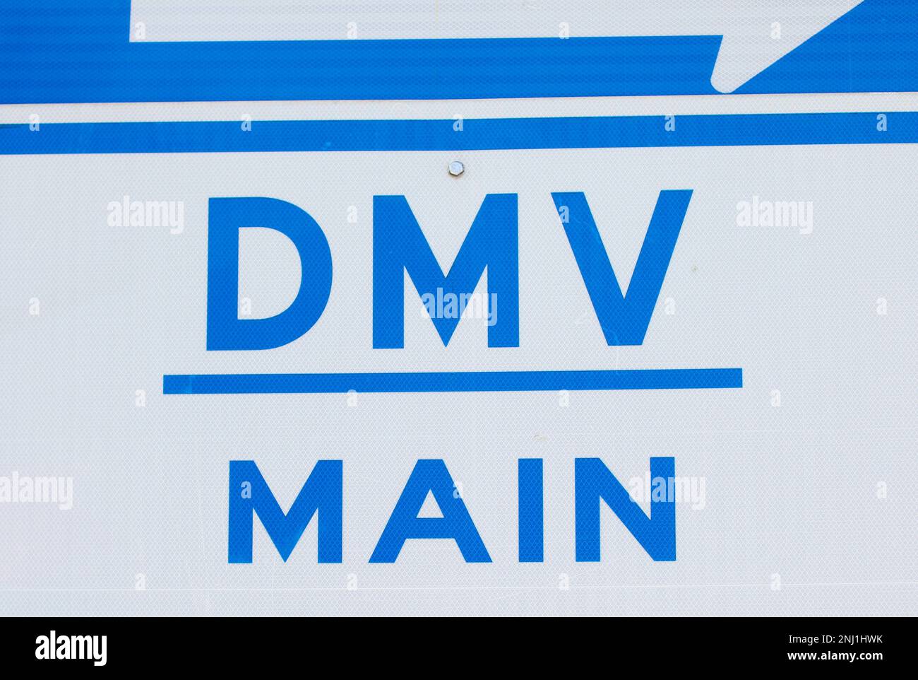 DMV sign street showing where to get drivers registration Stock Photo